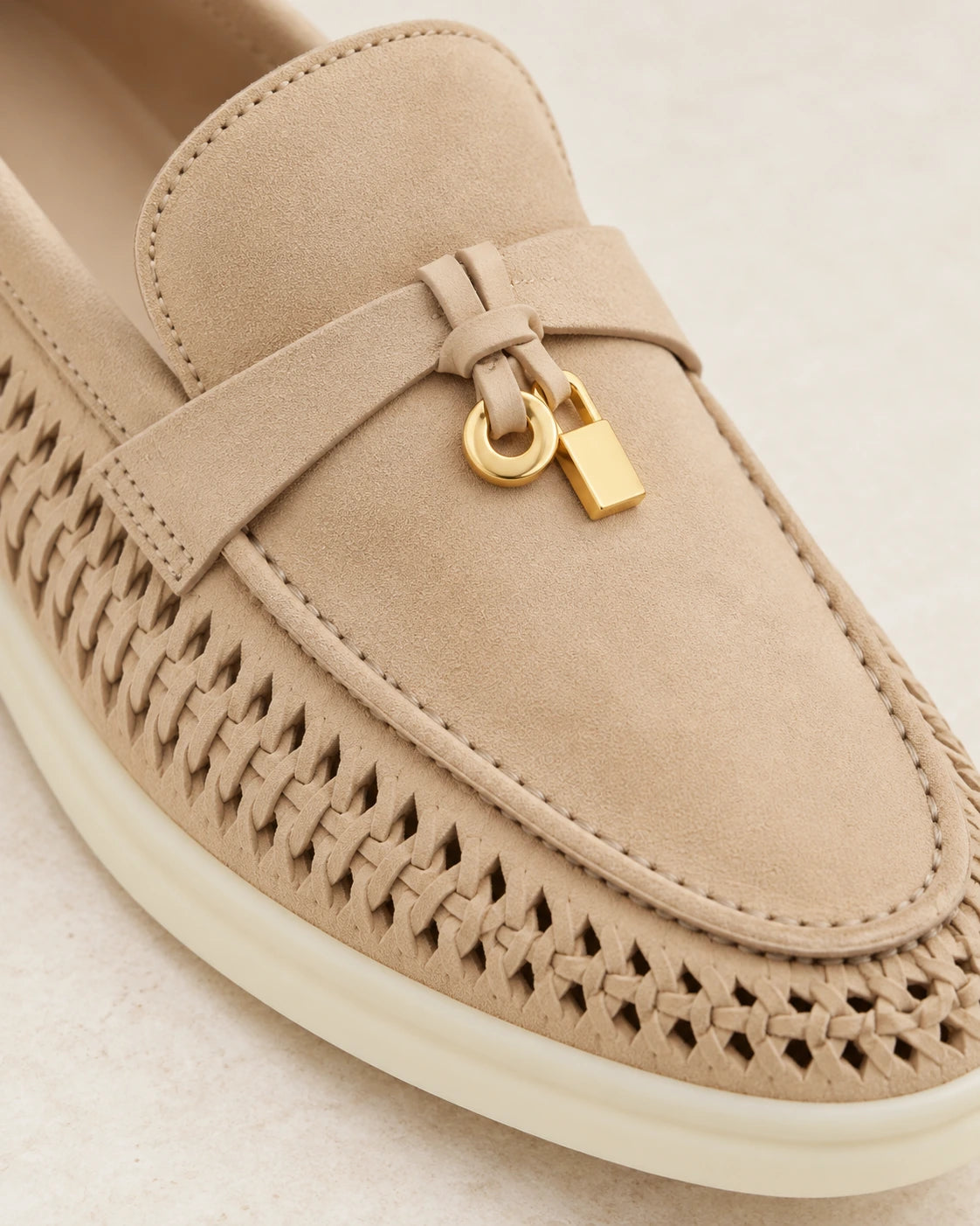 Saddle strap and gold-tone charm details