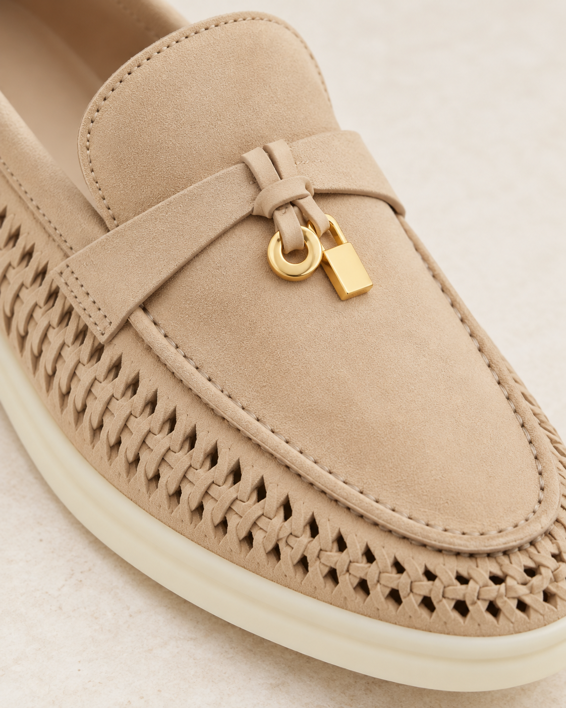 Saddle strap and gold-tone charm details